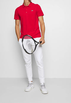Pull polo Lacoste rouge en tricot pour homme, coupe moderne et matière respirante, idéal pour compléter un look casual ou habillé.

